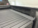 Load image into Gallery viewer, Close view of fitted side panels and bed clearance beside the Silver Bullet platform in a 2021 Chevrolet Silverado 1500
