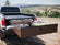 Load image into Gallery viewer, Representative Silver Bullet drawer loaded with storage totes on a Ford Super Duty
